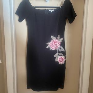 Black dress with flower embroidery.